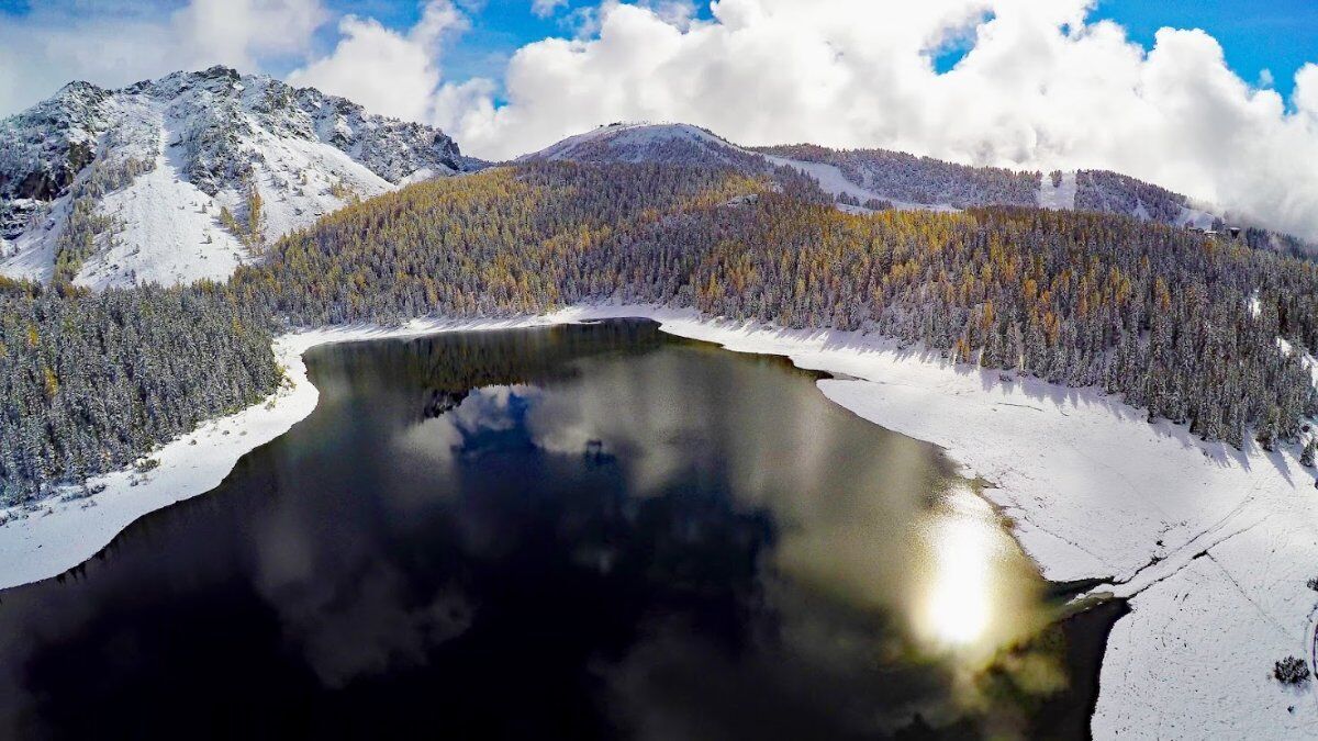 Ciaspolata al Lago Palù esplorando la Natura Addormentata desktop picture